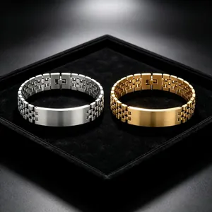 Detailed close-up of silver and gold titanium steel watchband style men's bracelets on velvet