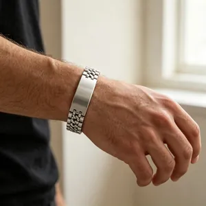 Close-up shot of a men's titanium steel watch-band style bracelet with a blank plate.
