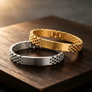 Close-up of gold and silver watch-band style steel bracelets with engravable ID bar