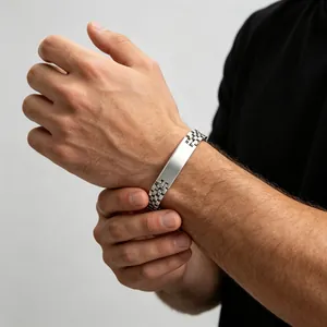 Close-up of men's titanium steel bracelet with polished curved plate and watch band link