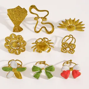 Detailed view of vintage flower and bow-knot rings in gold-plated stainless steel