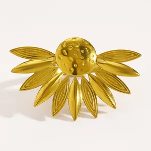 Macro view showing the intricate golden sunflower petals on this stainless steel ring