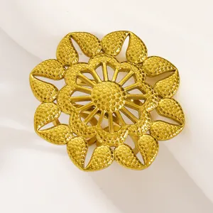 Detailed macro view of a vintage gold-plated stainless steel flower ring with textured petals