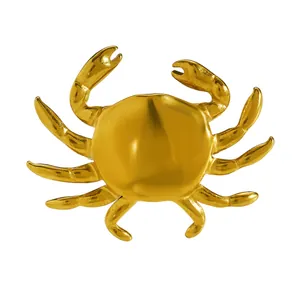 Detailed macro view of the gold-plated stainless steel crab ring with polished finish
