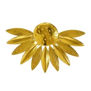 Close-up detail of a vintage golden sunflower-shaped stainless steel ring with textured petals