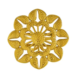 Close-up of vintage gold floral adjustable ring with textured petal details