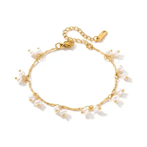 Detailed shot of a vintage gold-plated stainless steel bracelet with small white pearls