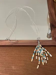 Bohemian beaded tassel necklace with turquoise accents and pearlescent tube beads