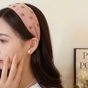 Elegant pink fabric headband with decorative gold star studs fashion hair accessory