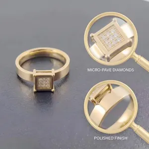 Vista macro della faccia quadrata con pavé di diamanti e finitura dorata lucida