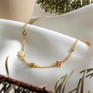 Collier en acier inoxydable plaqué or 18 carats avec breloques coccinelle et fleurs