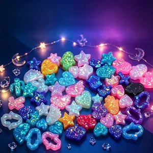 Close-up of colorful iridescent resin star and heart charms for DIY jewelry making