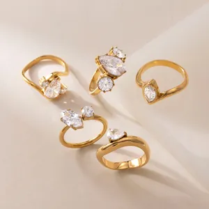 Detailed view of five gold-plated stainless steel rings with sparkling cubic zirconia