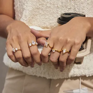 Set of 18k gold plated stainless steel zircon rings worn in a lifestyle setting