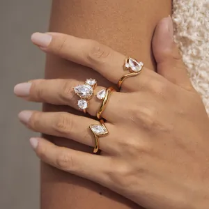 Set of 18k gold plated stainless steel rings with sparkling pear and marquise zircons