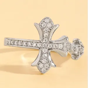 Macro close-up view of a silver double cross ring embellished with clear sparkling stones