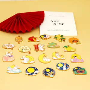 Close-up of assorted Mid-Autumn Festival themed alloy enamel charms for DIY jewelry making.