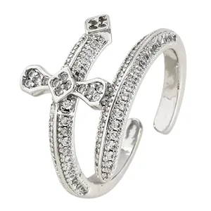 Detail view of a silver double cross open ring with sparkling cubic zirconia stones.