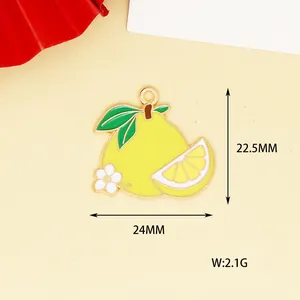 Macro view of yellow lemon enamel fruit charm showing 24x22.5mm dimensions and weight