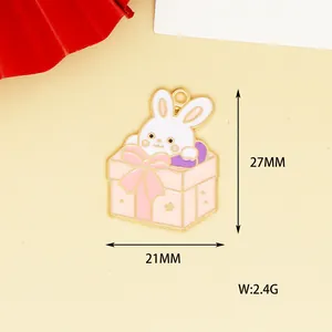 Detail view of a rabbit in a gift box enamel charm with dimensions 27x21mm and 2.4g weight.