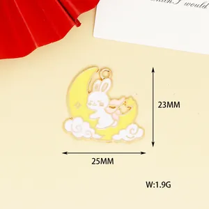 Close-up detail of cartoon rabbit on moon charm showing 23mm by 25mm dimensions