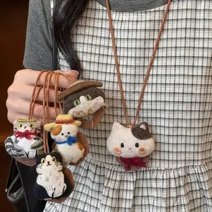 Detailed view of handmade cute fabric cat doll necklaces with leather cords