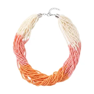 Handmade multi-strand seed bead necklace in gradient pink, orange and white tones