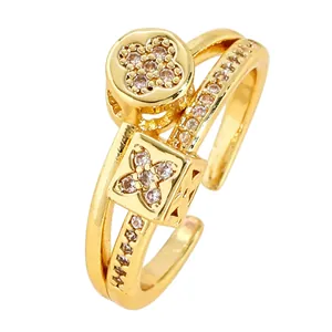 Detail shot of gold-plated stainless steel ring with clover zircon charms.