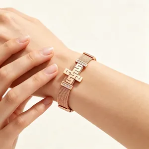 Rose gold stainless steel mesh bracelet with meander cross and crystal accents
