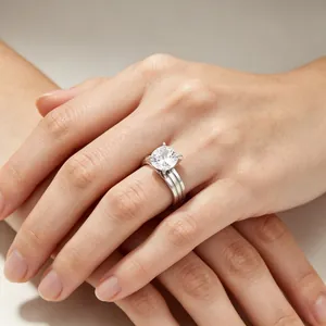Elegant four-prong solitaire ring with double-groove stainless steel band and CZ stone.