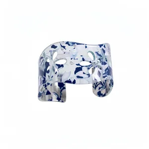 Modern acrylic hollow flower open bangle with blue and white marble pattern design