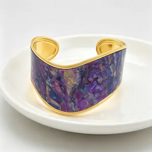 Detail view of a wide V-shaped cuff bracelet with purple and blue marble pattern.
