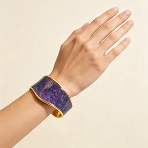 Detail view of wide gold-plated cuff bracelet with purple marbled oil painting inlay