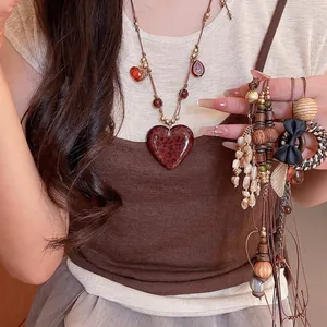 Retro Bohemian tiger eye stone heart necklace featuring a stylish leopard print pendant