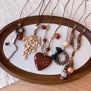Vintage Bohemian necklaces set with heart and tassel pendants for winter sweaters