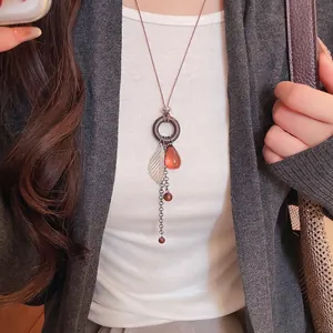 Vintage Bohemian tiger eye stone tassel necklace for women, elegant long sweater chain.