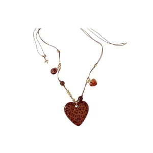 Vintage Bohemian style necklace featuring a large leopard print heart pendant for women