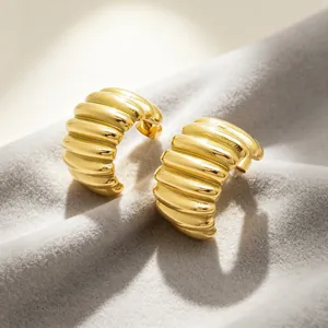 Macro view showing the detailed texture of 18K gold plated stainless steel pleated earrings