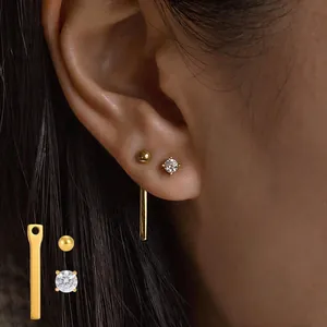 Minimalist 18K gold plated stainless steel stud earrings with detachable jacket and CZ stones.
