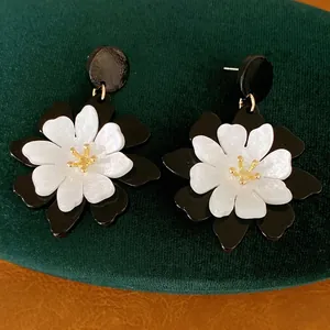 French vintage black and white acrylic flower statement earrings with silver needles.