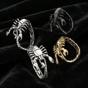 Detailed view of scorpion-shaped metallic bracelets in silver, gold, and black colors