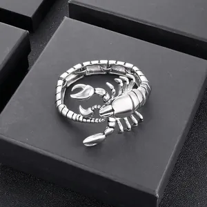 Detailed view of the silver scorpion-shaped titanium steel bracelet on a black gift box