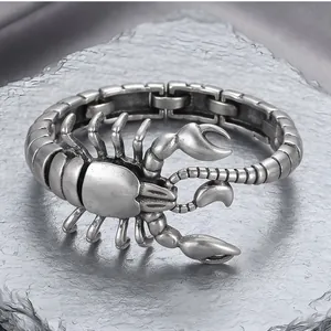 Detailed macro view of a vintage silver titanium steel scorpion bracelet for men.