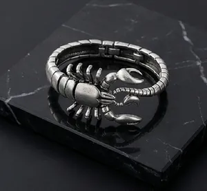 Close-up of vintage silver scorpion bracelet with detailed metal craftsmanship