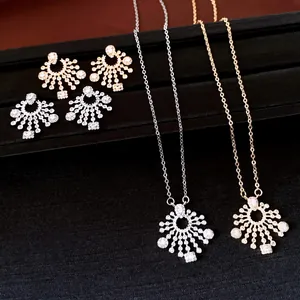 Close-up of elegant zircon round pendant earrings and necklace jewelry set