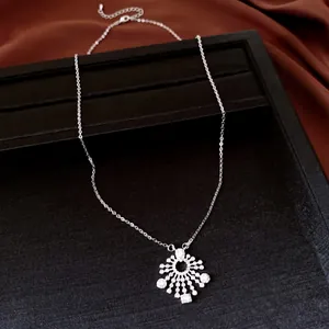 Detail shot of elegant silver snowflake pendant necklace with sparkling zirconia stones