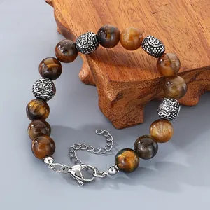 Close-up of retro tiger eye stone beaded bracelet with stainless steel extension chain.