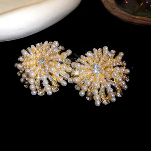 Detailed macro view of elegant French retro pearl and rhinestone flower stud earrings
