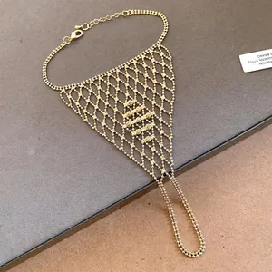 Elegant gold hollow mesh finger bracelet with integrated ring and chain jewelry