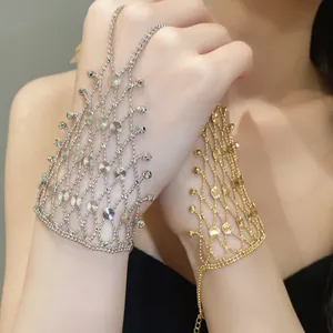Elegant silver and gold hollow tasseled slave bracelet shown as a detailed worn-on view